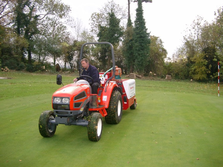 Barry Pace of Speedcut Contractors in action with the Gwazae on one of the greens.JPG