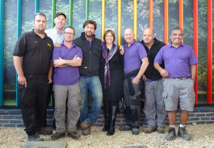 BLEC team Tom Shinkins (Ieft) with Gary Mumby (in cap) and Sue Mumby with TV presenter Nick Knowles and the DIY SOS team at Little Miracles centre in Peterborough