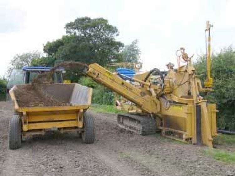 Clay top soil above free draining sand demands custom built drainage