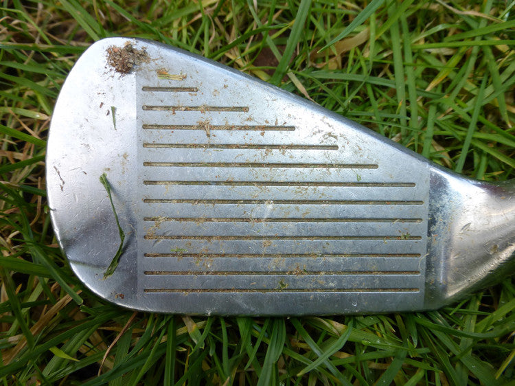 Plate 2 Golf club with soil and sand in grooves