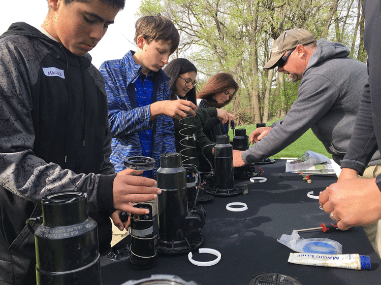 Students-learn-vital-STEM-skills-in-a-golf-course-setting.gif